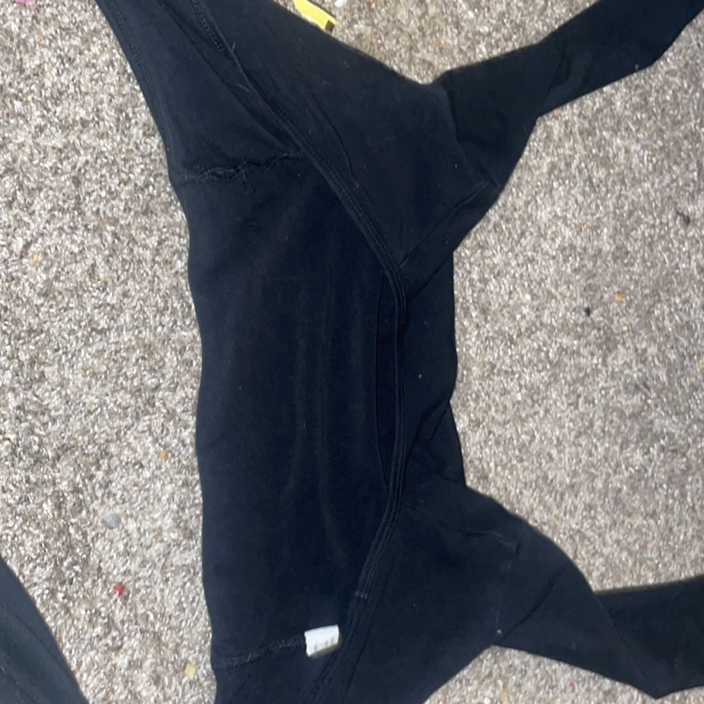 It’s a black ballet sweater that has been used it’s pretty small